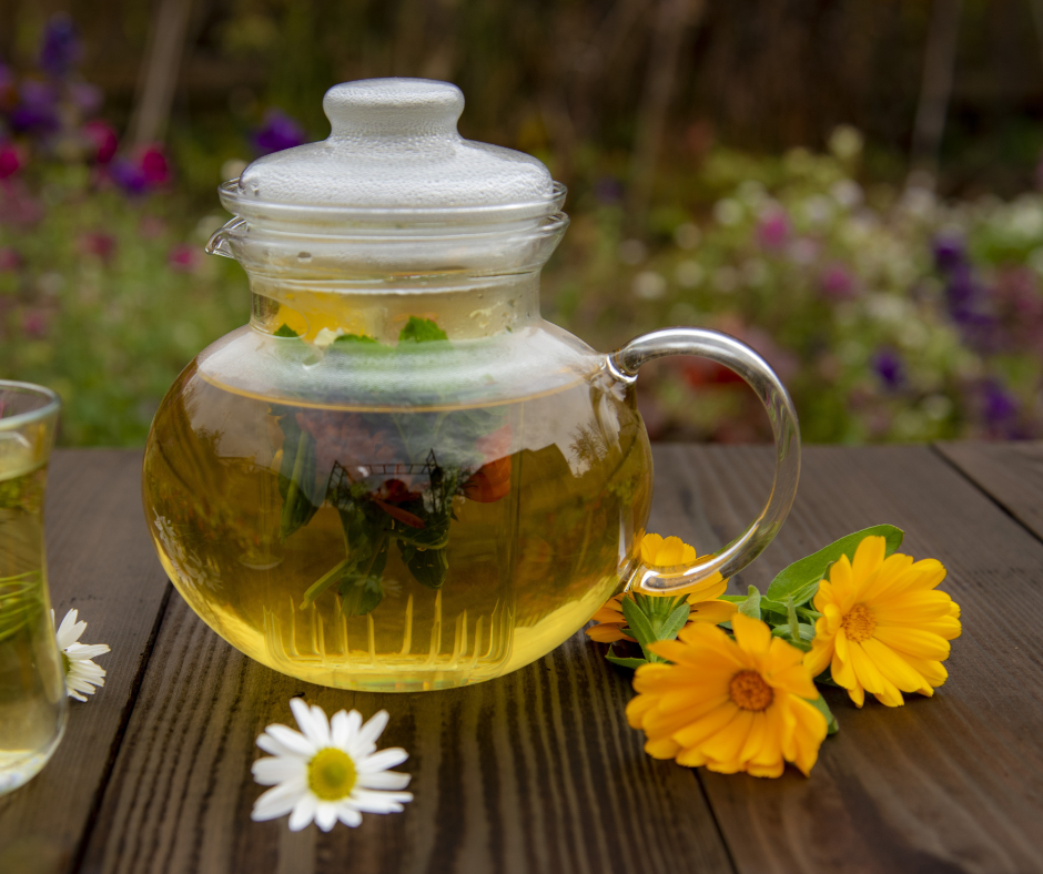 calendula tea in a glass tea pot