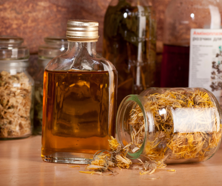 calendula oil in a jar with perals