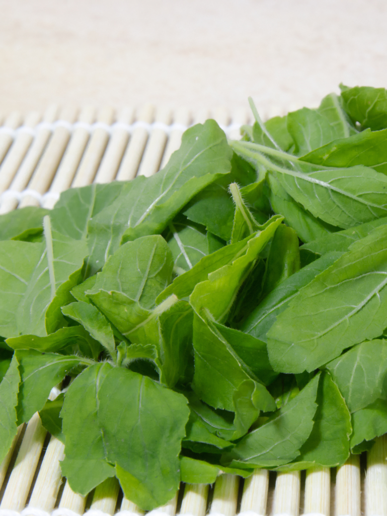 holy basil on a bamboo tray