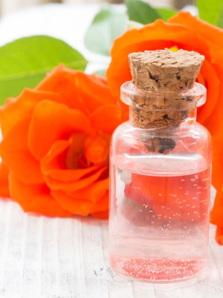 rose water in a glass bottle